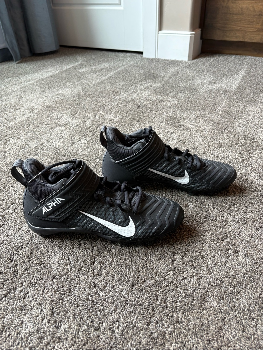 Youth Nike Black and White Alpha Football Cleats